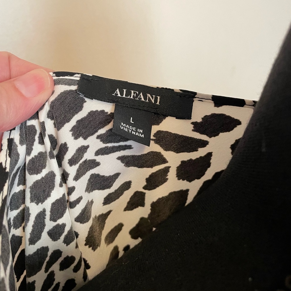 Alfani animal print blouse with crochet trim.